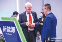 Participants in the Invest in Beijing Conference exchange views at the venue.
